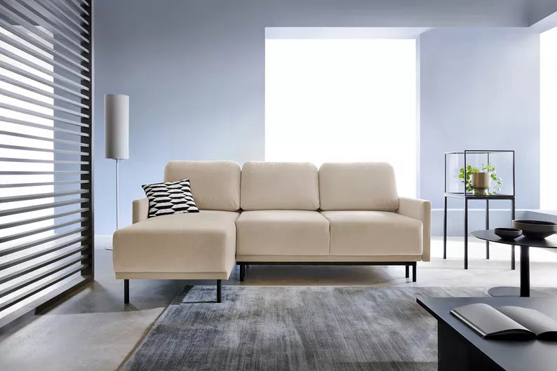 NOMIEL L-formas izvelkamais stūra dīvāns ar konteineru, universāls gaiši bēšs hidrofobs samts - N1 Home